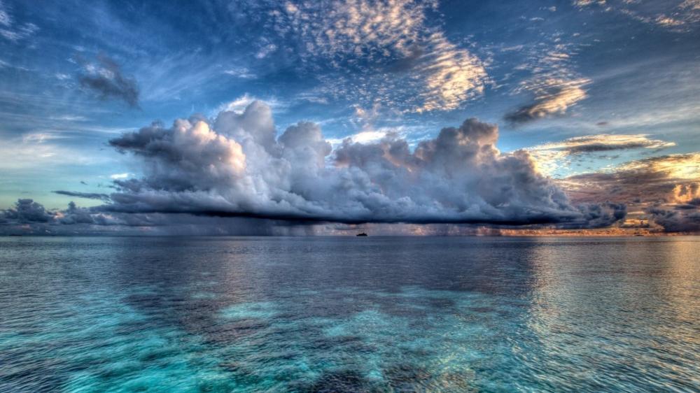 Majestic Seascape Under Dramatic Skies wallpaper