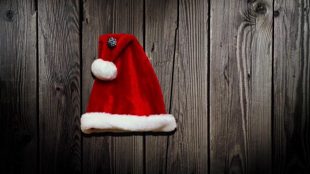 Santa's Hat on Rustic Wood Planks wallpaper