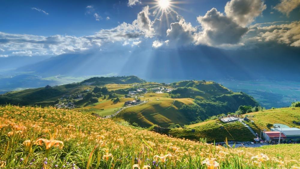 Golden Sunlight Over Serene Valley Hills wallpaper