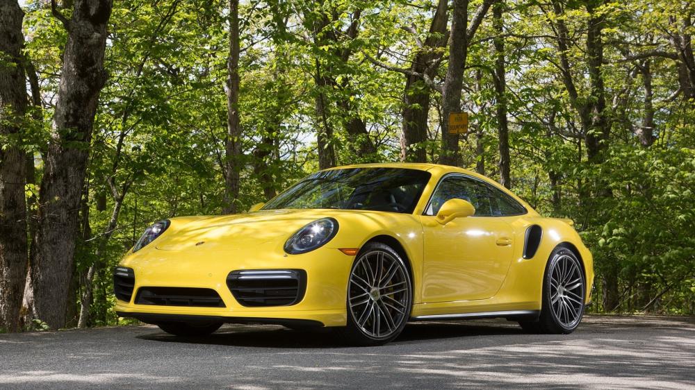 Yellow Porsche 911 Turbo S in Forest Setting wallpaper