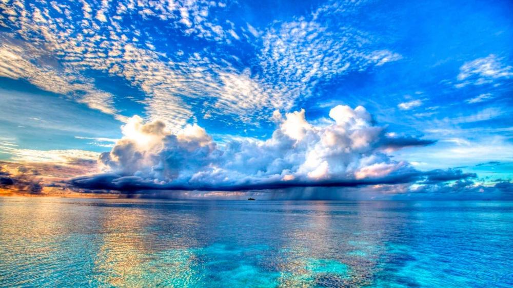 Endless Horizon and Tranquil Sea under Vibrant Skies wallpaper