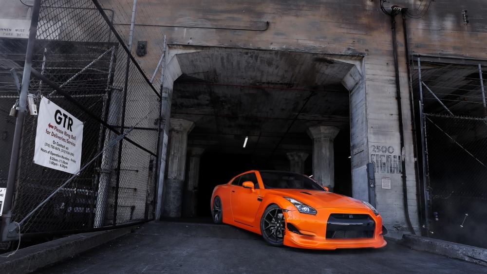 Nissan GT-R in Urban Setting with Striking Orange Finish wallpaper