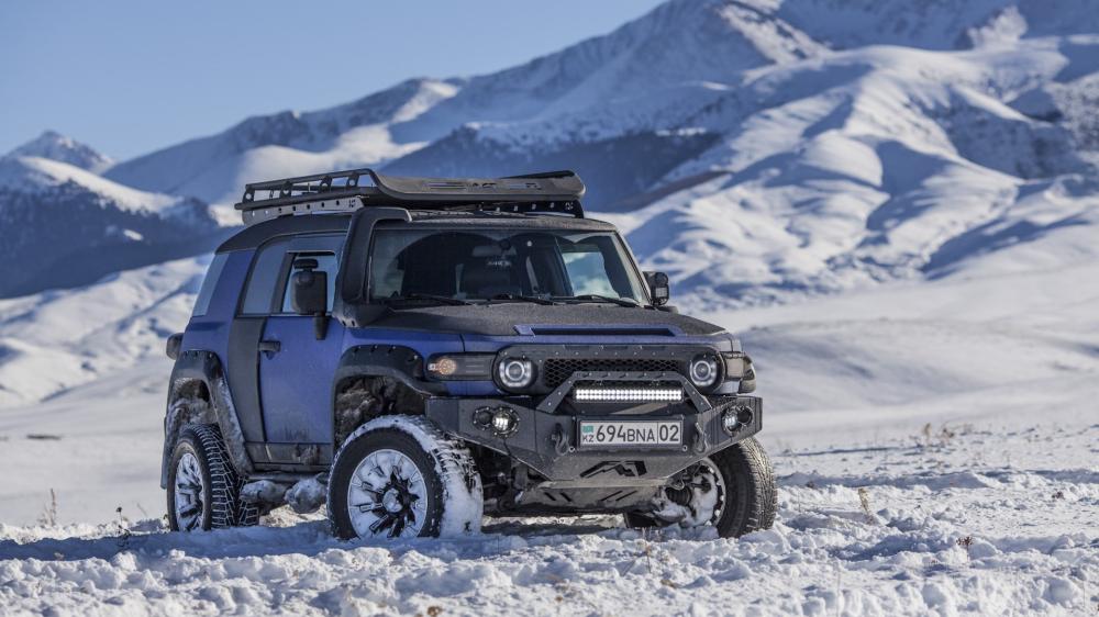 Rugged Toyota FJ Cruiser in Snowy Wilderness wallpaper