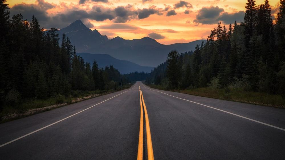 Sunset Journey Through Mountain Roads wallpaper