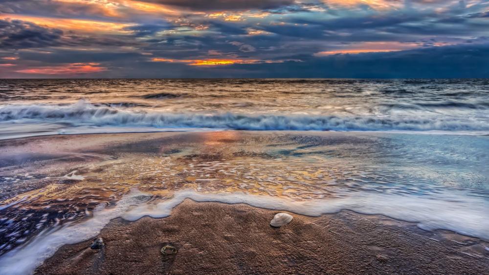 Serene Tides at Sunset's Edge wallpaper