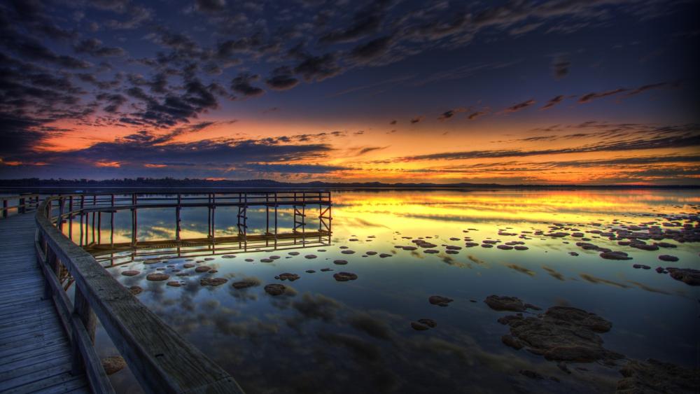 Sunset Serenity Over Calm Waters wallpaper