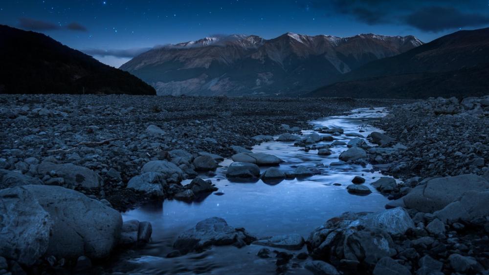 Mountain River Under a Starry Night Sky wallpaper