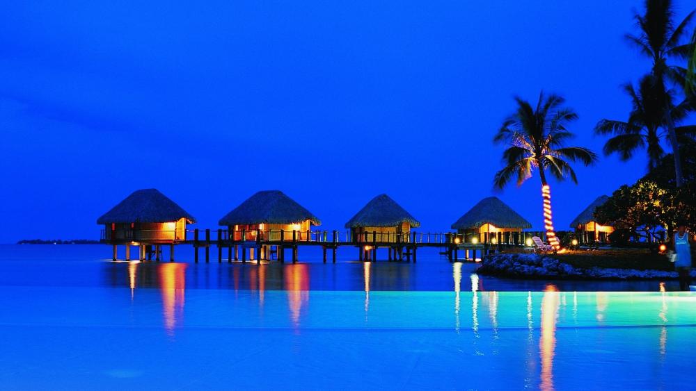 Overwater Bungalows at Dusk in Tropical Paradise wallpaper