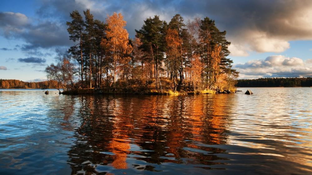 Tranquil Autumn Reflections on a Serene Island Lake wallpaper