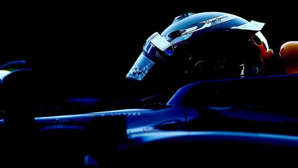 Formula One Driver in Dynamic Motion wallpaper