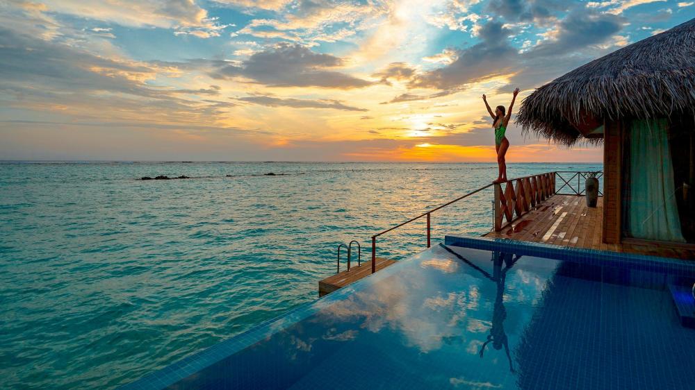 Tropical Paradise: Sunset by the Poolside wallpaper