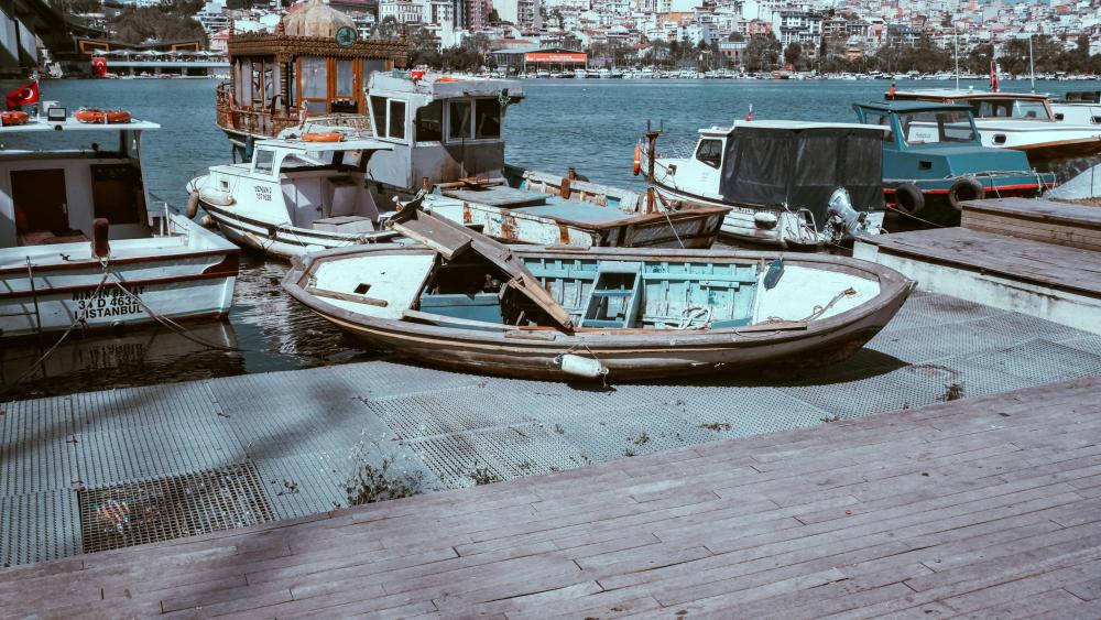 Vintage Boats Resting in Tranquil Harbor wallpaper