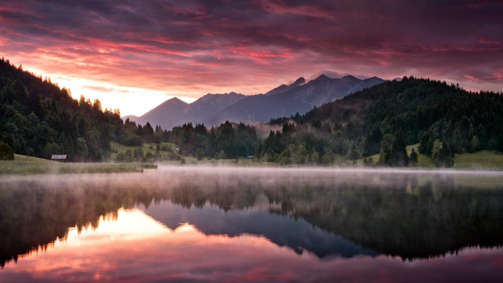 Dawn's Serene Reflections Over Mountain Lake wallpaper