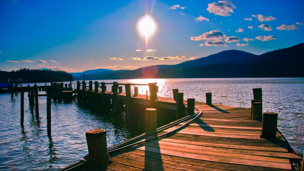 Sunlit Tranquility at the Lakeside Pier wallpaper