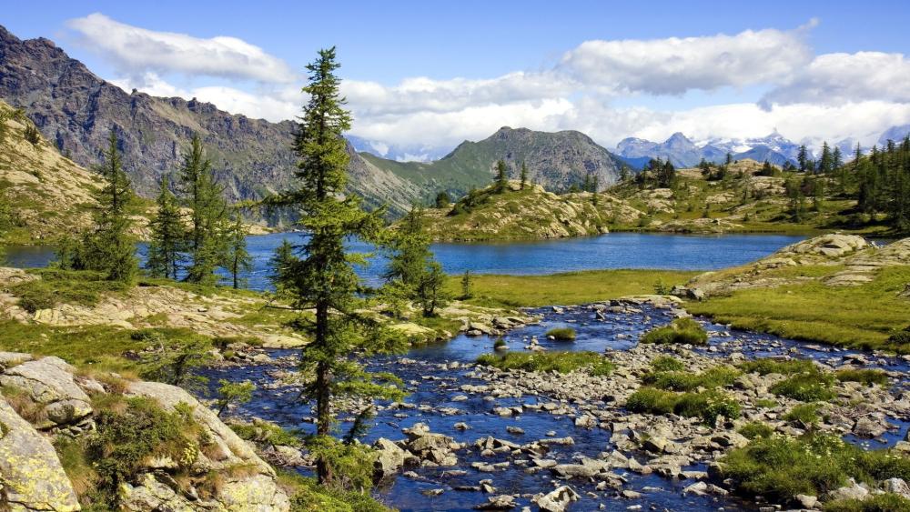 Riparian Serenity in Majestic Mountain Landscape wallpaper