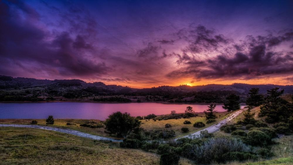 Purple Dusk Over Tranquil Lake wallpaper