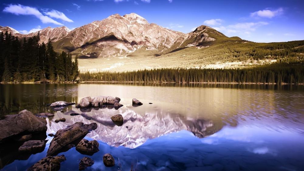 Mountain Majesty Reflecting on Tranquil Waters wallpaper