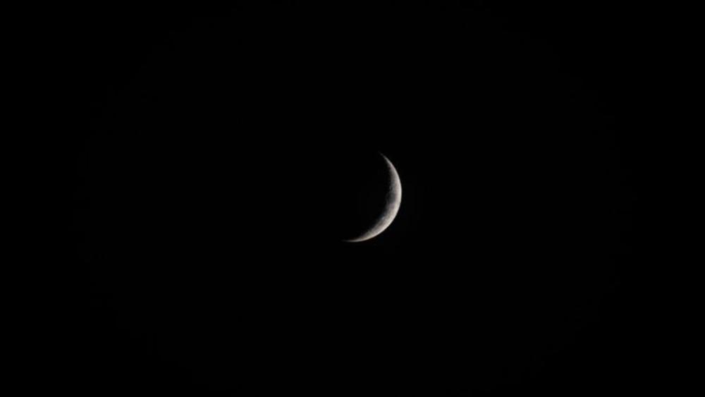 Crescent Moon in a Cosmic Sea wallpaper