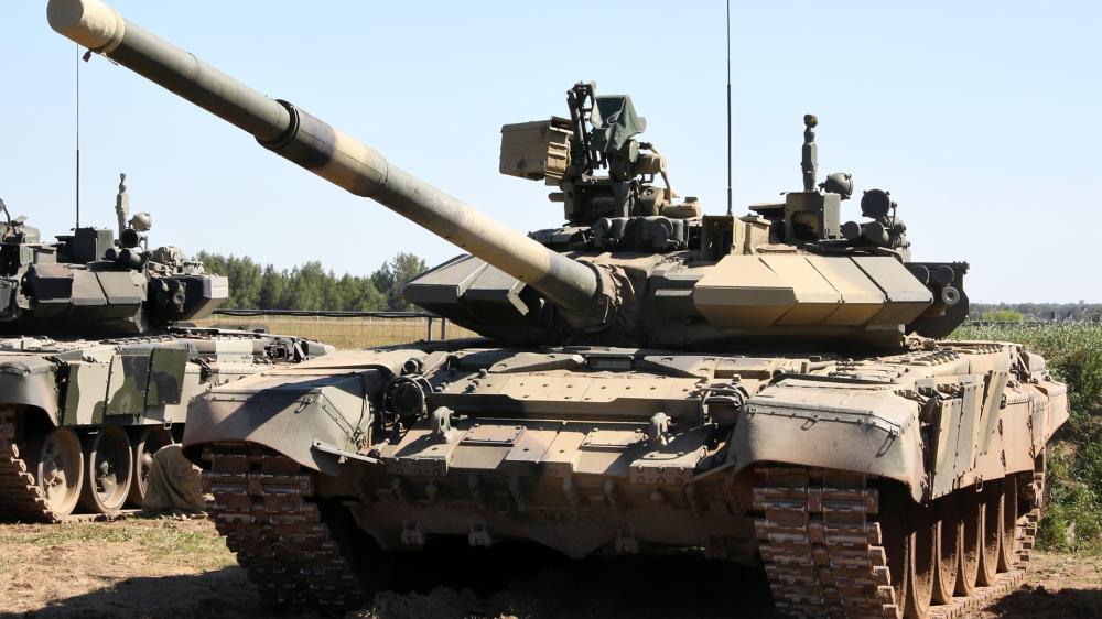 Tank in Action on Rough Terrain wallpaper