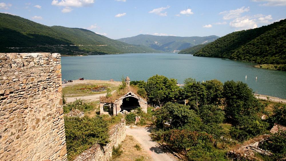 Ananuri Fortress Overlooks Serene Georgian Lake wallpaper