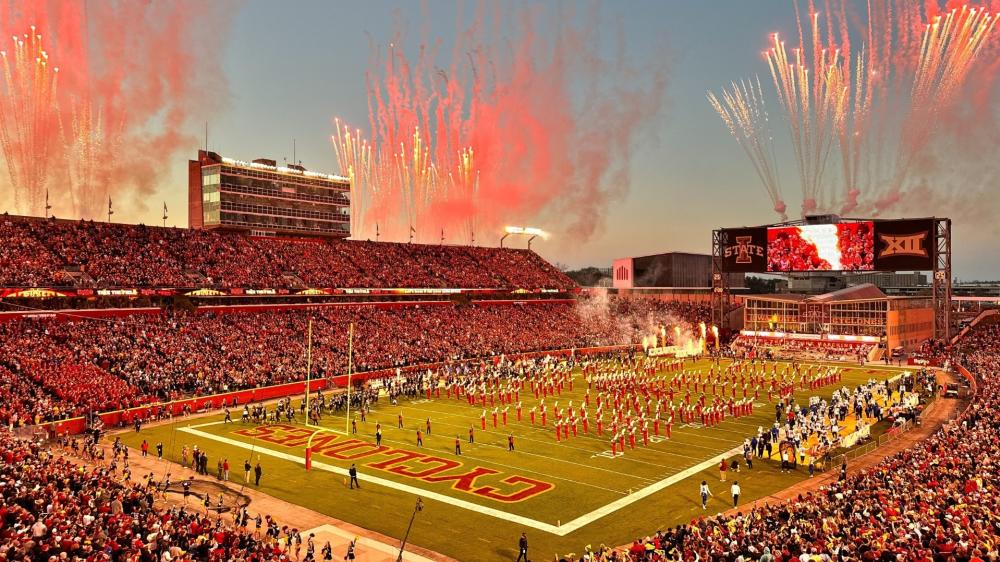 Exciting Football Game Under Fireworks Display wallpaper