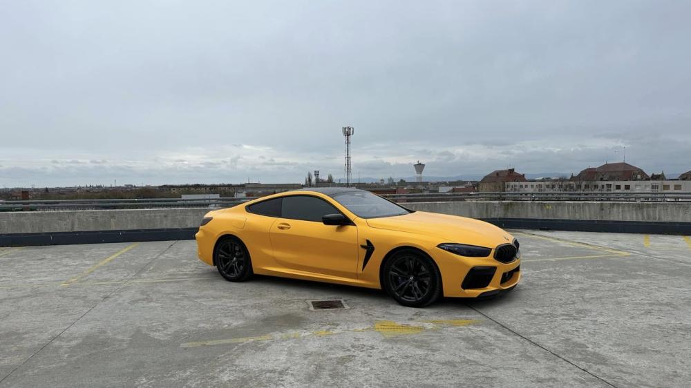 Yellow BMW M8 Muscle Car on Urban Rooftop wallpaper