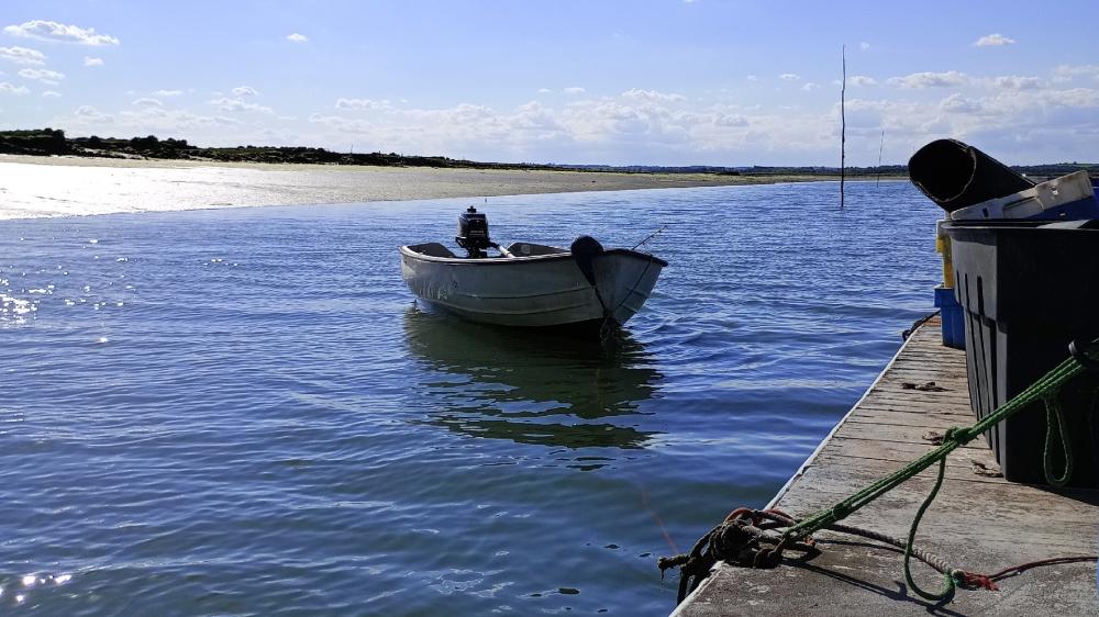 Tranquil Boat Scene on Mersea Island wallpaper