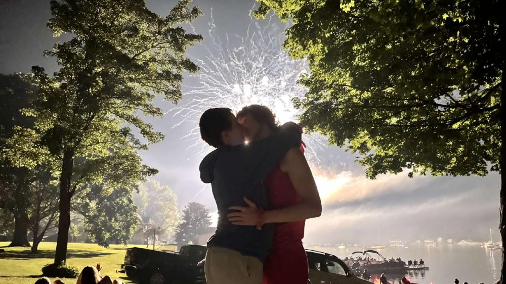 Romantic Fireworks Kiss by the Lake wallpaper