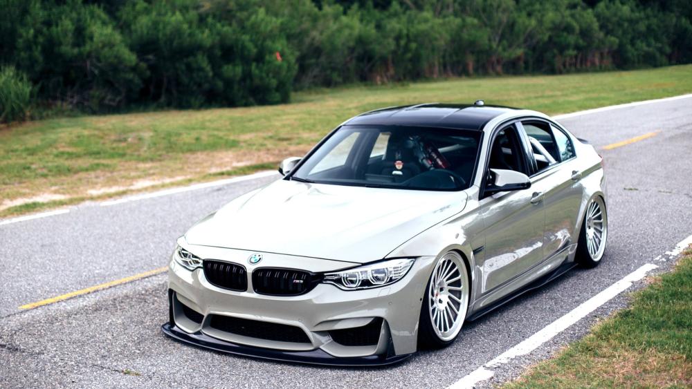 Sleek BMW M3 on a Coastal Road wallpaper