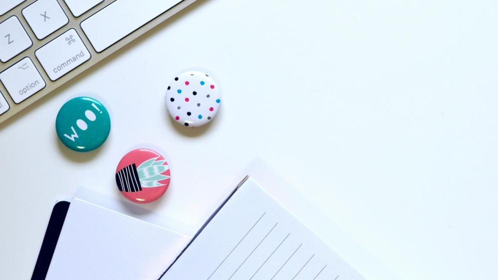 Abstract Desk Composition with Buttons and Notebook wallpaper