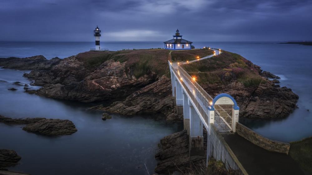 Illa Pancha Lighthouse at Twilight in Spain wallpaper