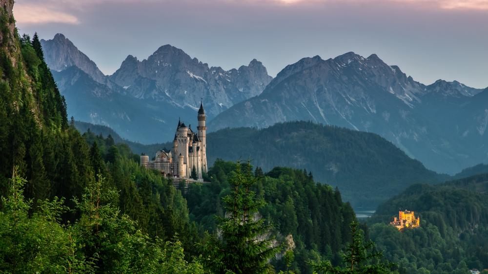 Enchanted Castles Amidst Majestic Alpine Peaks wallpaper