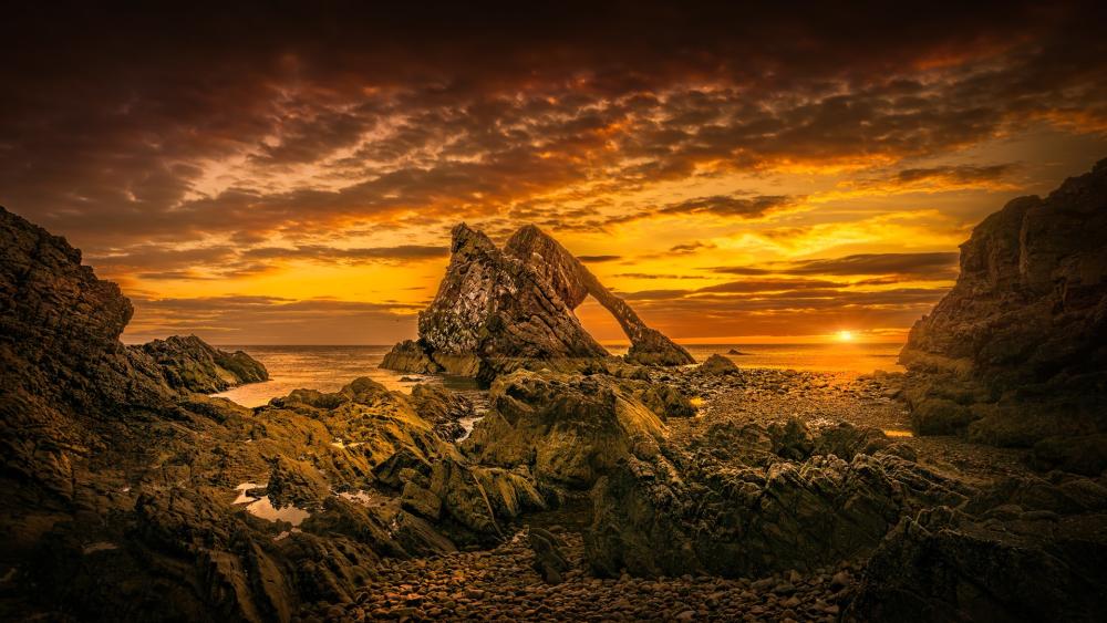 Bow Fiddle Rock at Sunset's Fiery Embrace wallpaper