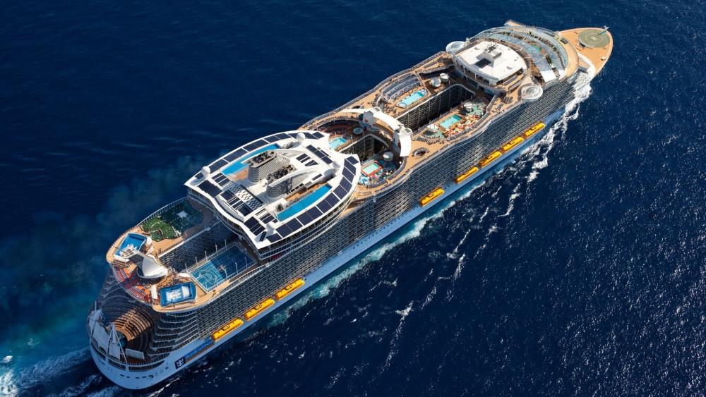 Cruise Ship Gliding Through Blue Waters wallpaper