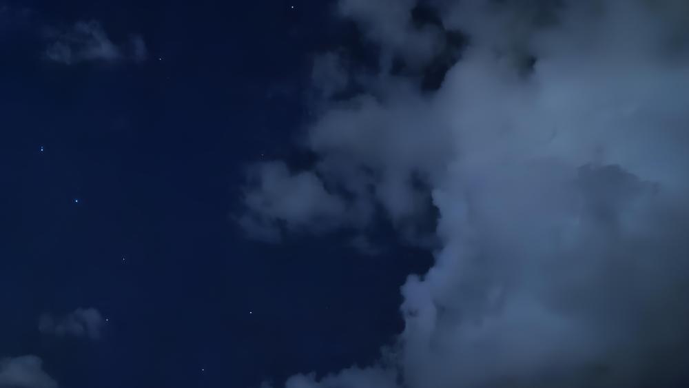 Cumulus Clouds Under the Night Sky wallpaper
