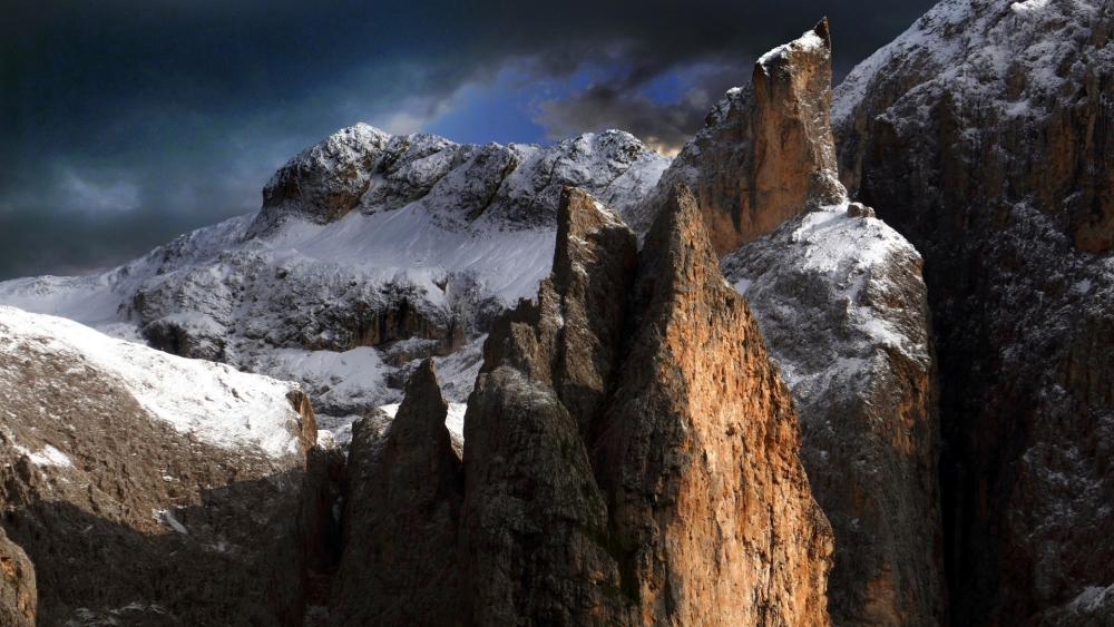 Majestic Mountain Ridge Under Dramatic Skies wallpaper