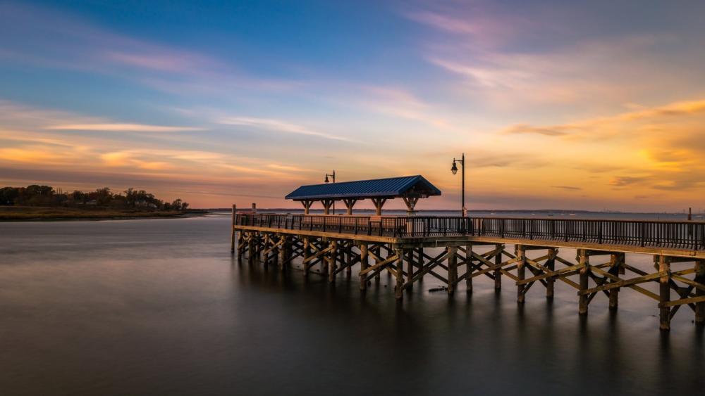 Tranquil Sunset Over Serene Pier wallpaper