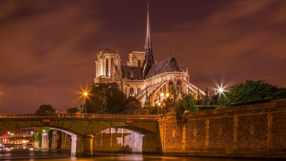 Notre Dame Cathedral Illuminated at Night wallpaper