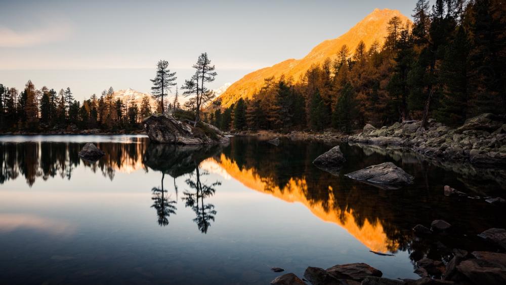 Lago di Saoseo's Tranquil Reflection Escape wallpaper