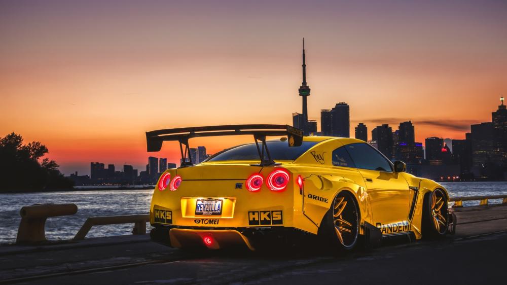 Nissan GT-R Unleashed Against City Sunset wallpaper
