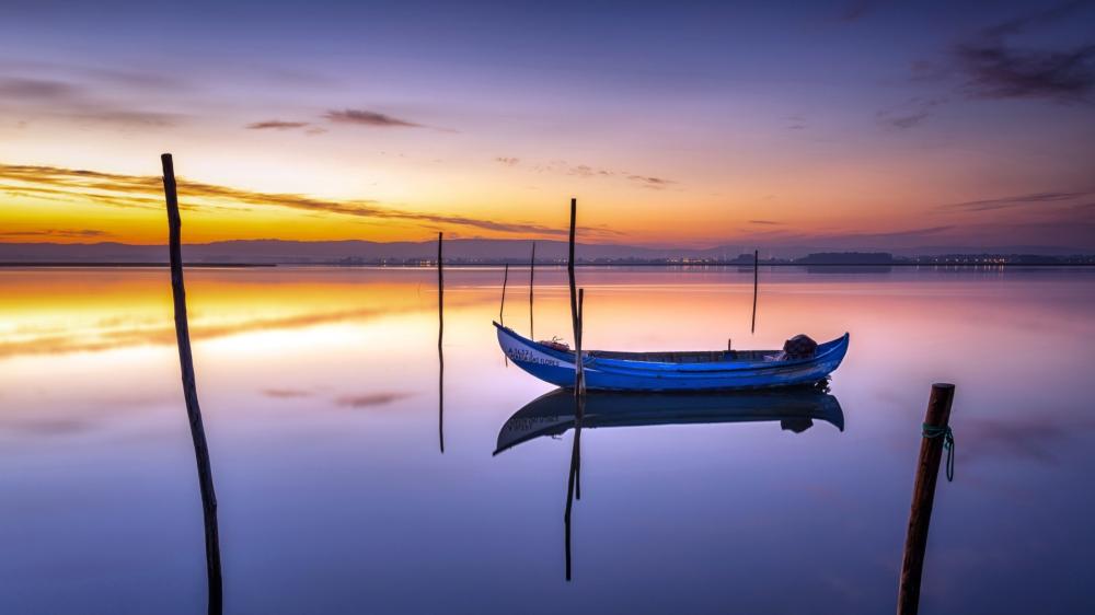 Sunset Serenity on a Tranquil Lake wallpaper