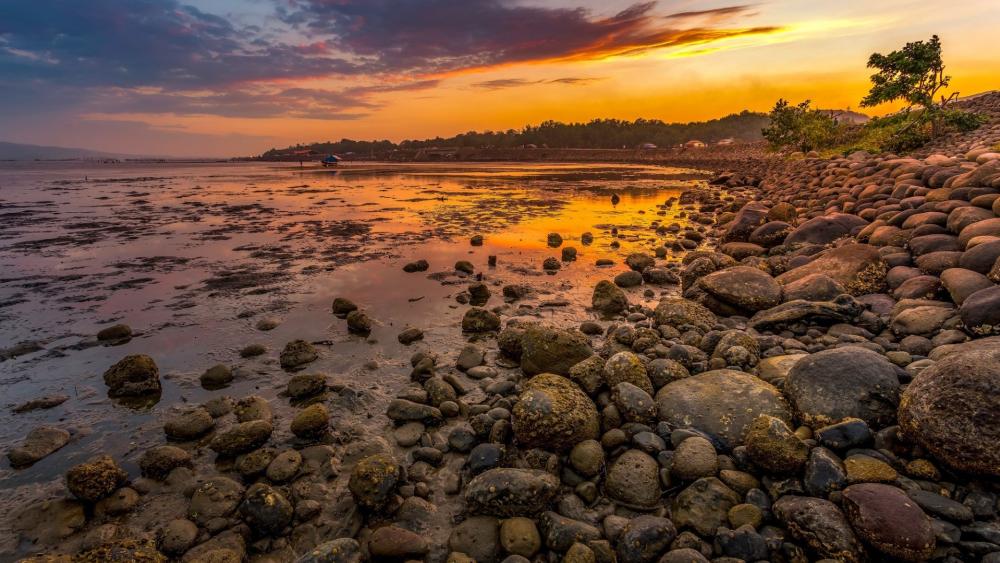 Pebble-Strewn Sunset in Ozamiz City wallpaper
