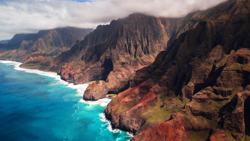 Majestic Beauty of Honopu Arch and Nā Pali Coast wallpaper