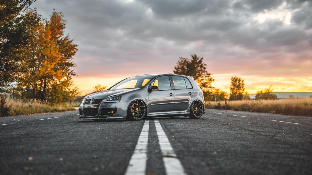 Volkswagen Golf on Scenic Autumn Drive wallpaper