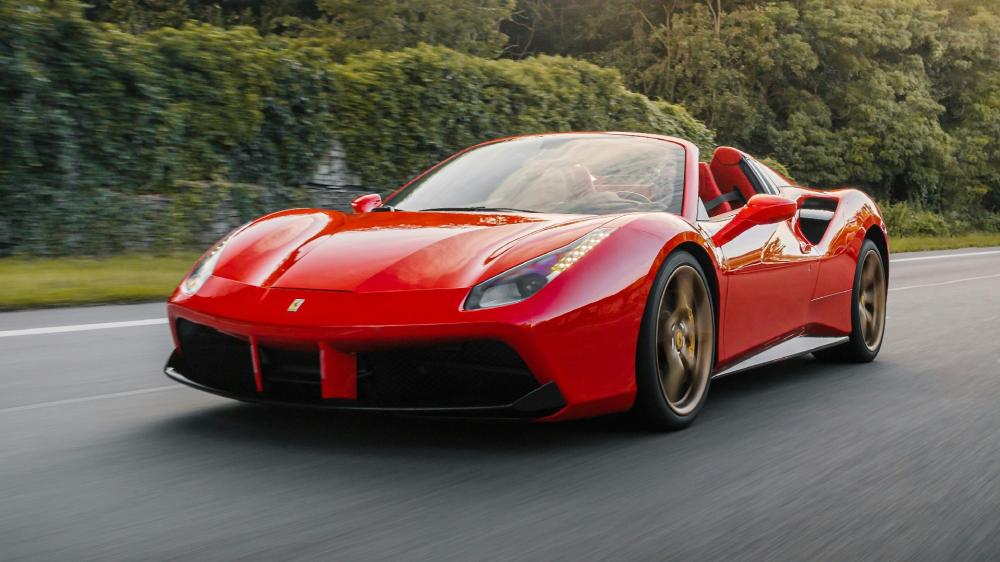 Ferrari 488 Spider Racing Through Scenic Road wallpaper