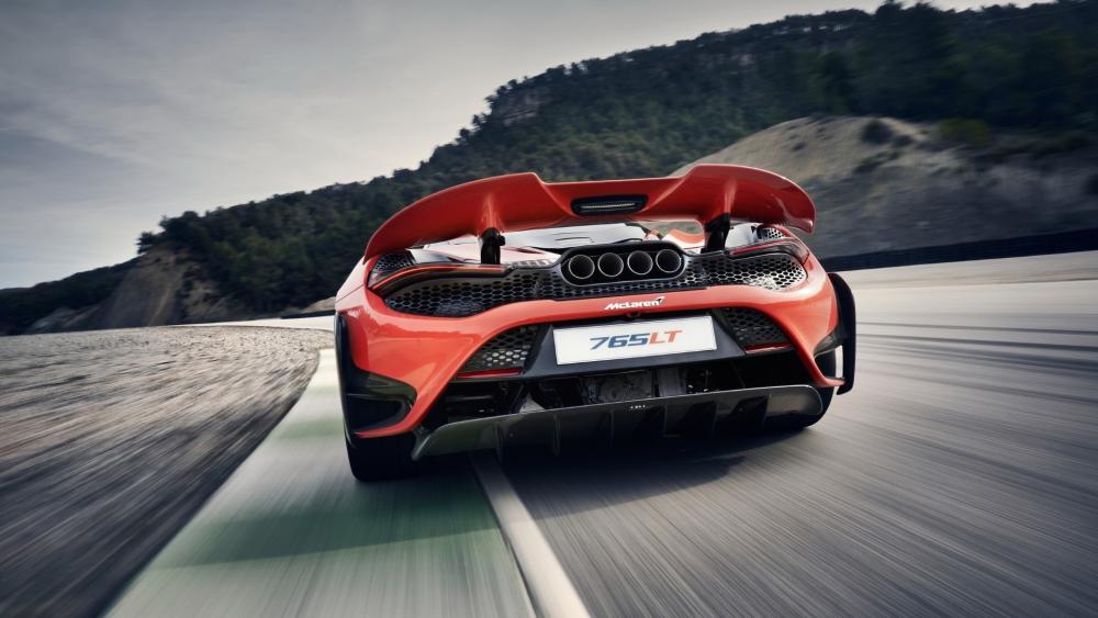 McLaren 765LT Racing on Scenic Mountain Road wallpaper