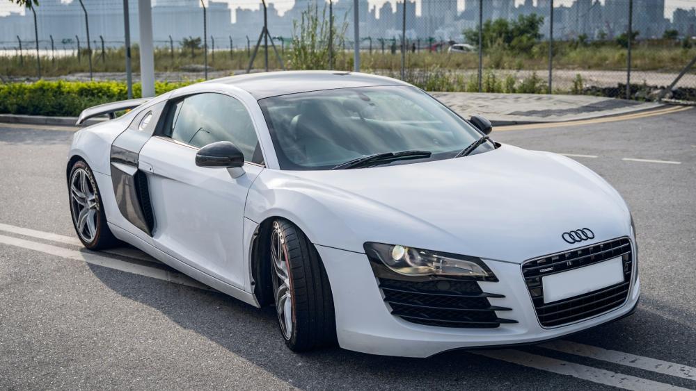 White Audi R8 parked in the middle of the road in Kai Tak, Hong Kong wallpaper