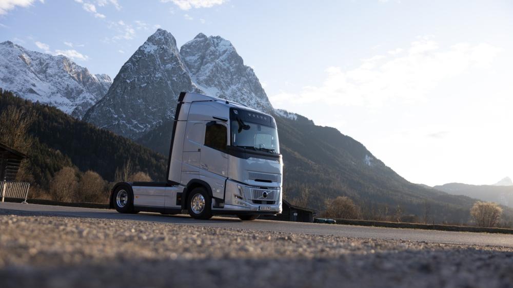 Volvo Truck in Majestic Mountain Landscape wallpaper