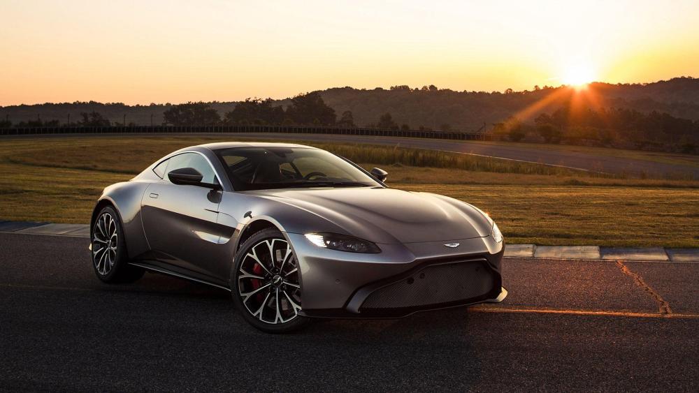Sleek Aston Martin Vantage Sunrise Drive wallpaper
