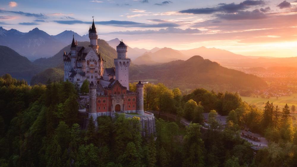 Majestic Castle in Tranquil Mountain Landscape wallpaper